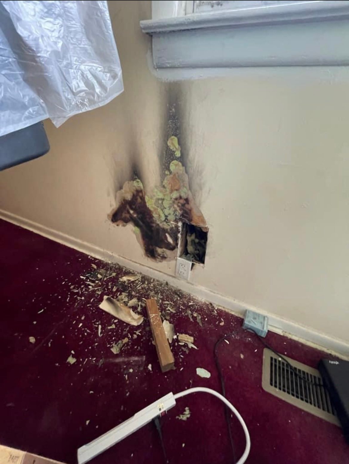 Damaged wall before repair
