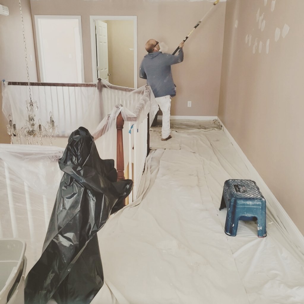 RFCP painter rolling a wall with floors and railings fully covered
